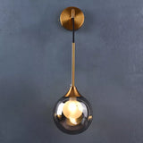 Applique murale pendante dorée avec boule de verre ambre ou gris fumé